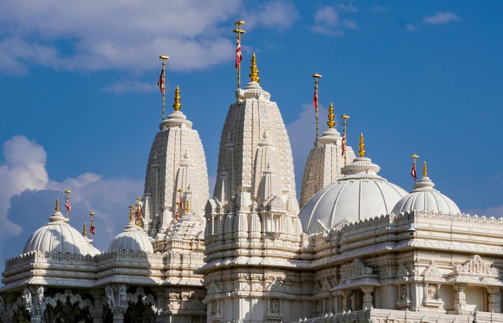 Captivating view of BAPS Shri Swaminarayan Mandir under a clear blue sky.